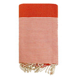 fouta traditionnelle nid d’abeille mikanda orange 100x200 cm ou 200x200 cm 100 % coton 190 g/m², absorbante, légère et peu encombrante pour la plage ou la maison. Se transforme en paréo