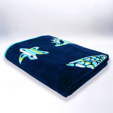 Serviette de plage calypso XL éponge velours Jacquard Bleu 140x180 cm 400g/m² douce et très absorbante, idéale plage et piscine ou pique-nique.
