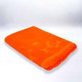serviette de plage éponge velours jacquard unis ciselé Kerlaz Orange 90x170 340g/m² douce et absorbante, idéale piscine, plage ou salle de bain.