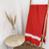 fouta plate traditionnelle kozo rouge 100x200 cm, coton 190 g/m², absorbante, légère et peu encombrante pour la plage ou la maison. se transforme en paréo