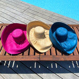 Chapeau artisanal de Madagascar Capeline en fibres naturelles, élégant et féminin, idéal pour la plage, la ville ou les vacances.